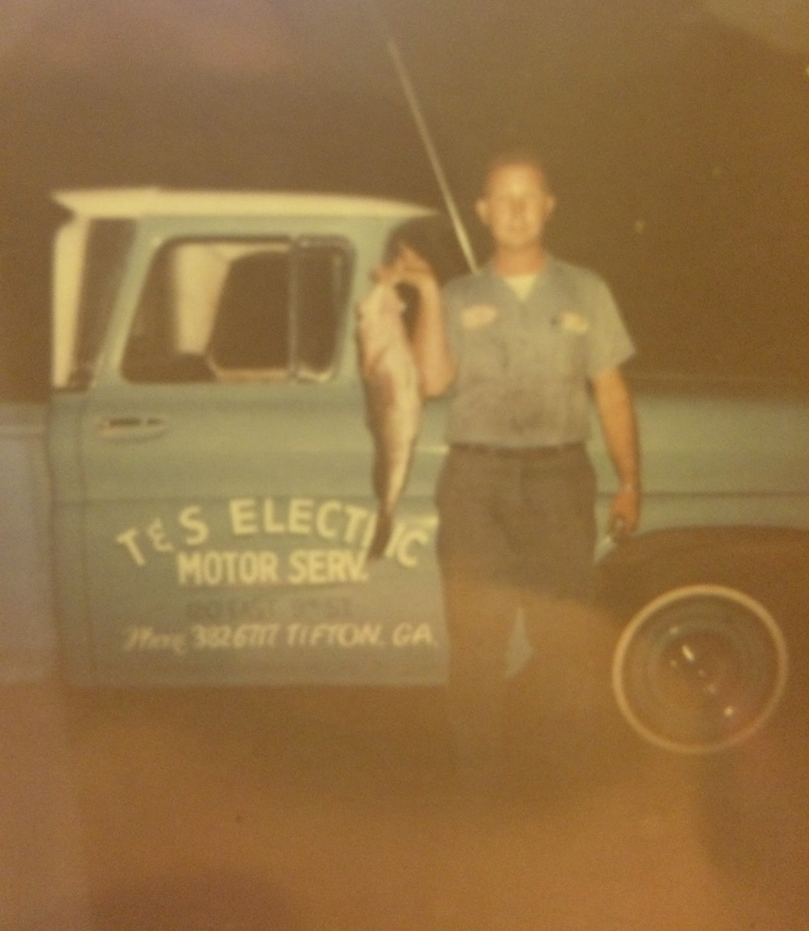 Mr. Gus with his T & S Electric work truck